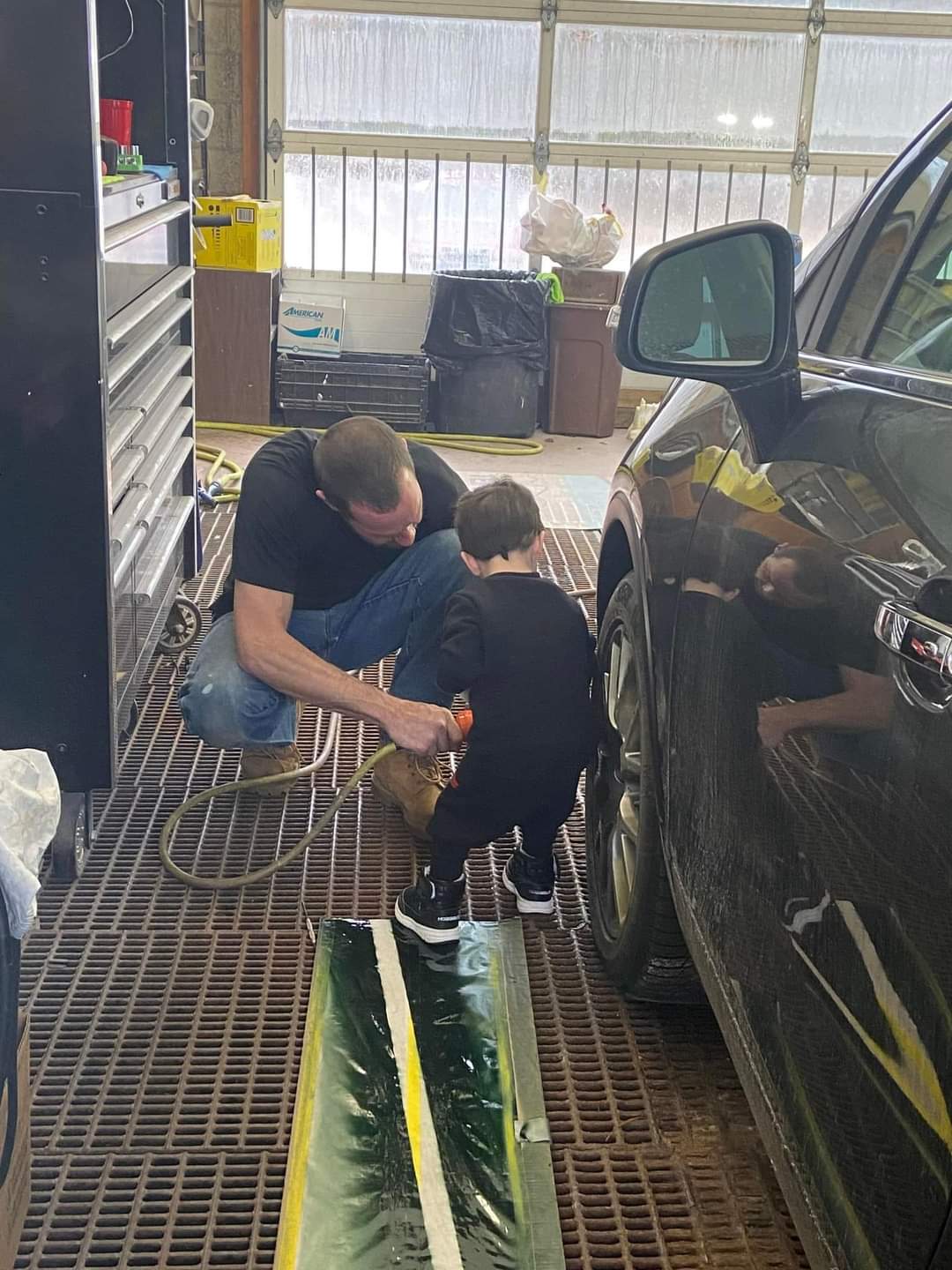 boy helping with repairs